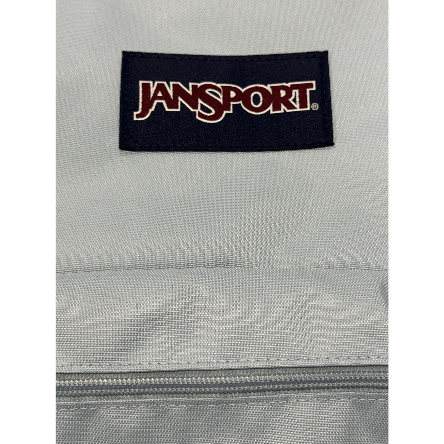 JanSport Drawstring Backpack With Front Zipper Pocket In Light Blue
